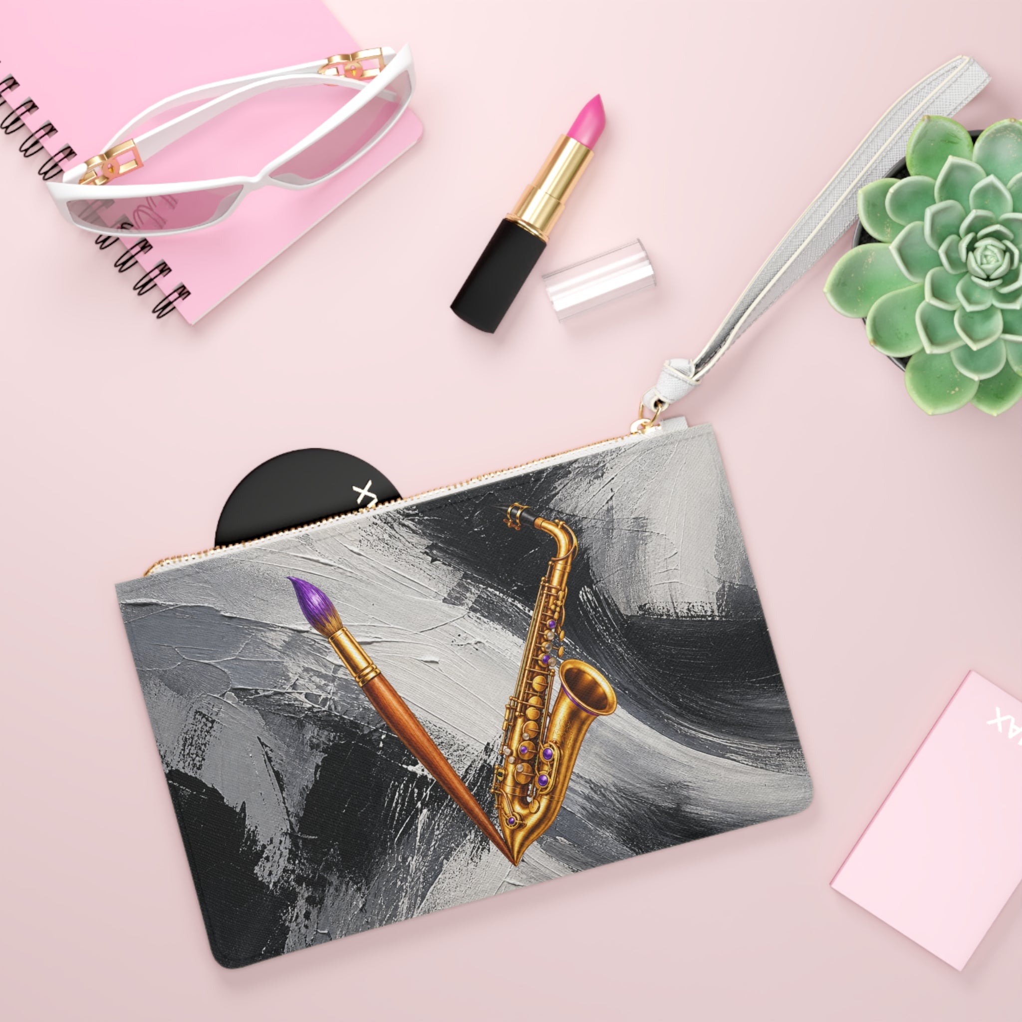 Jazzy Smoov saxophone and paintbrush clutch bag